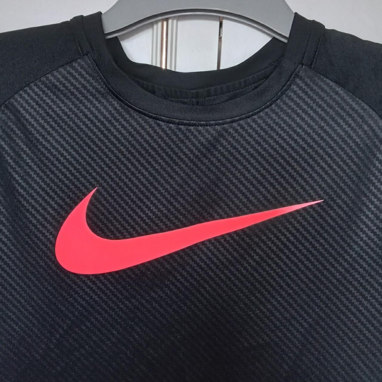 pink black and white nike shirt