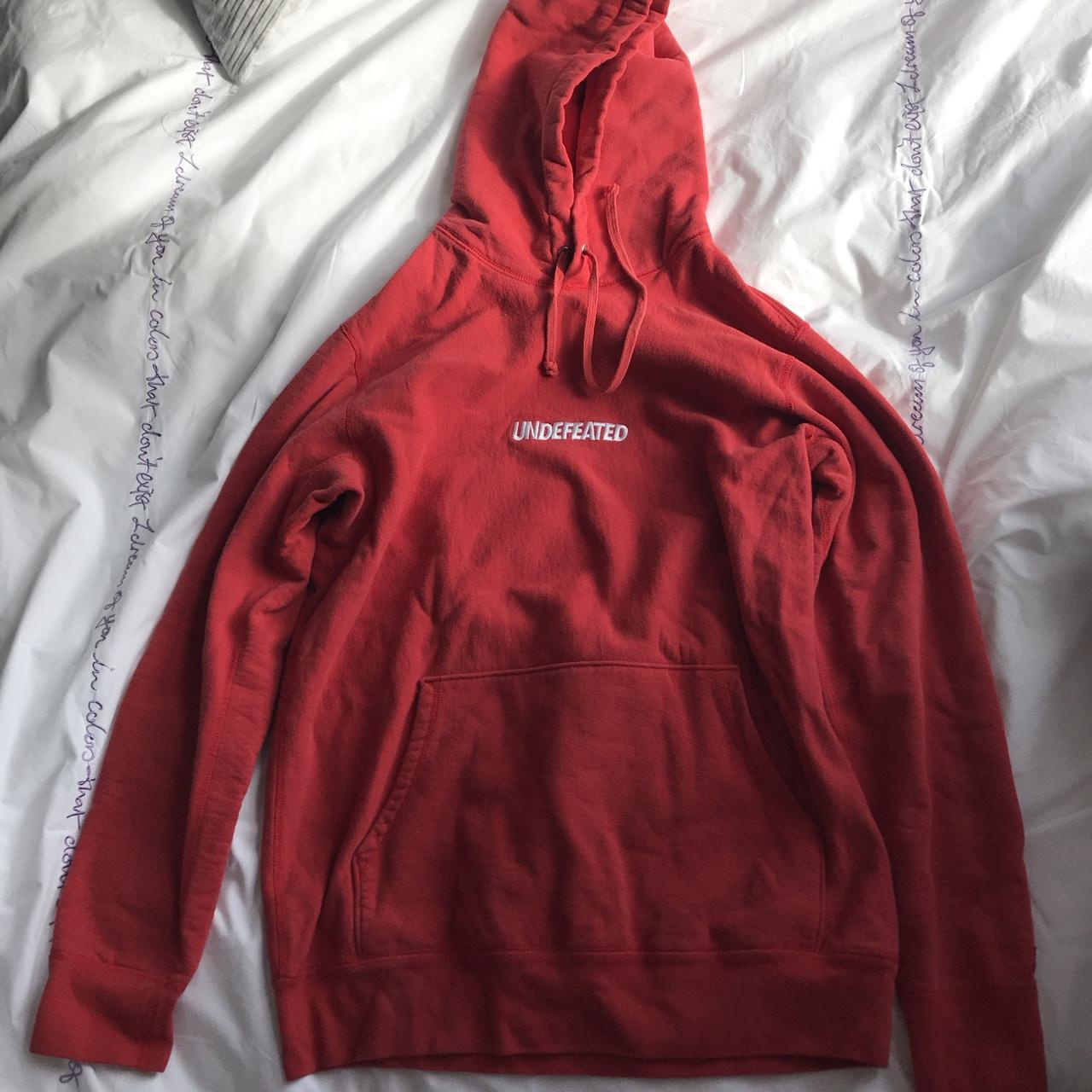 Red undefeated hoodie in perfect condition size... - Depop