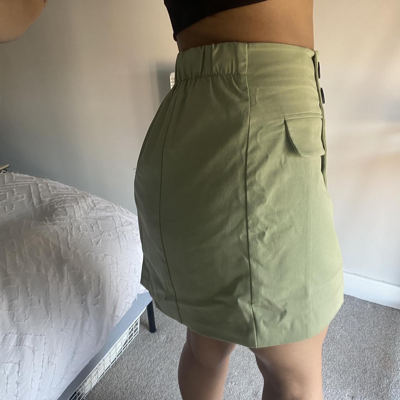 Bershka green mini skirt, zips up at the back,... Depop