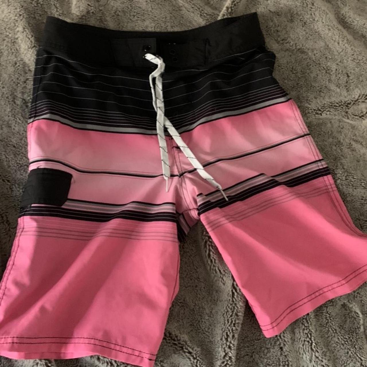 black and pink swim trunks