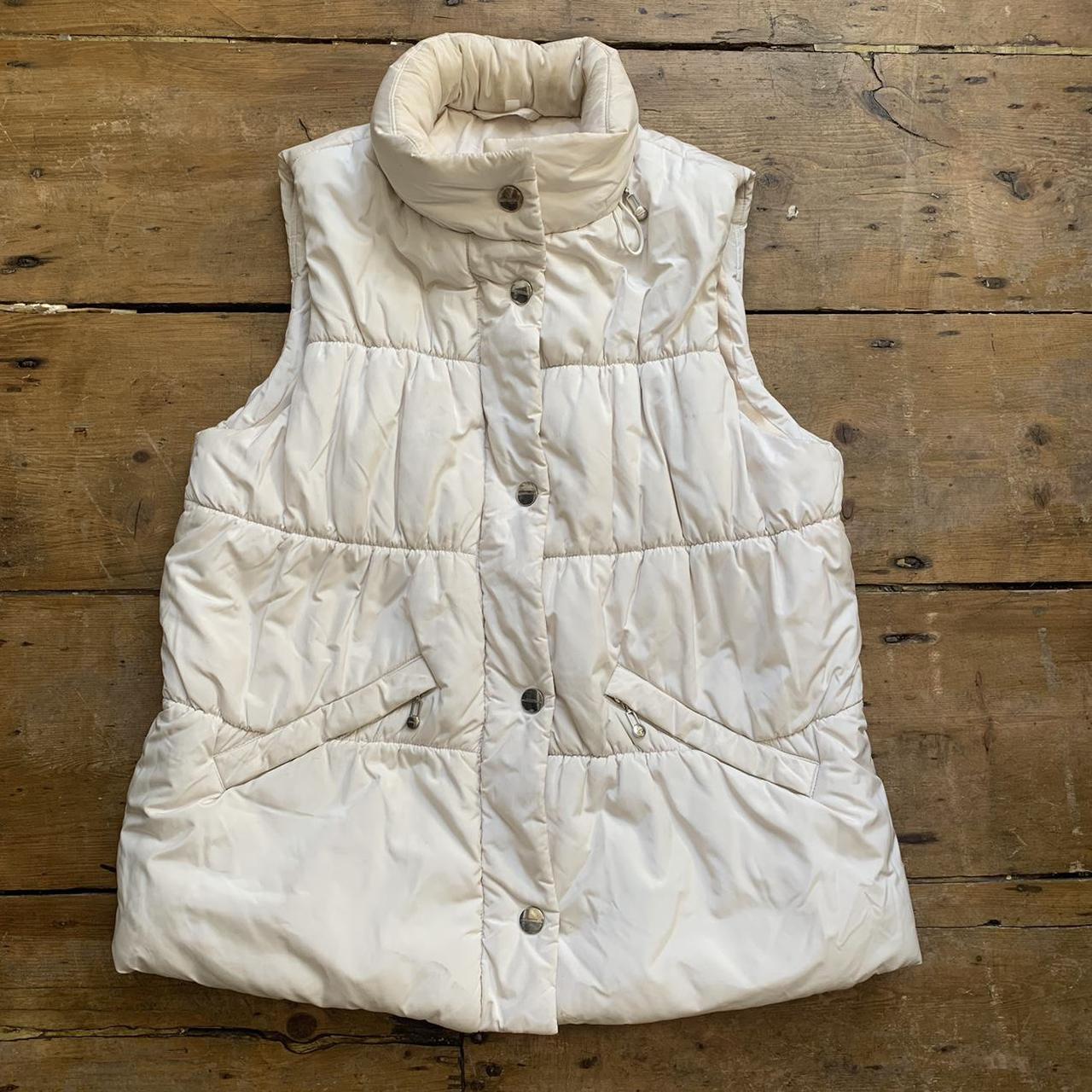 White puffer gilet with zip and poppers down the... - Depop