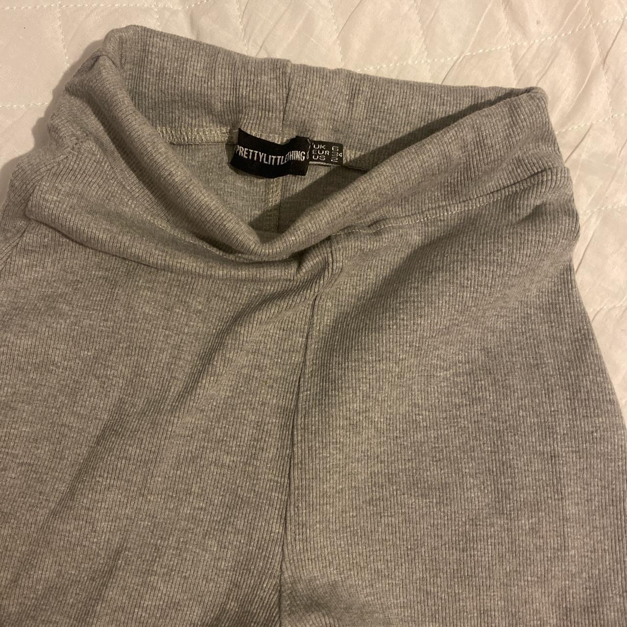 Pretty Little Thing grey flared leggings with split... - Depop