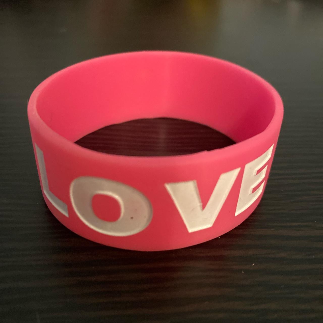 Pink rubber bracelet with LOVE written in white 💞 Depop