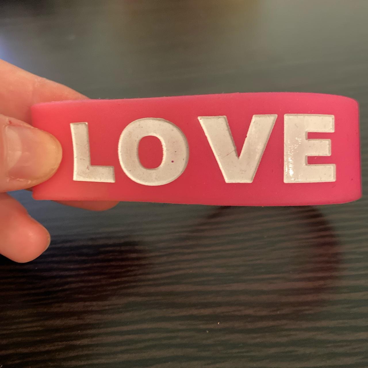 Pink rubber bracelet with LOVE written in white 💞 Depop