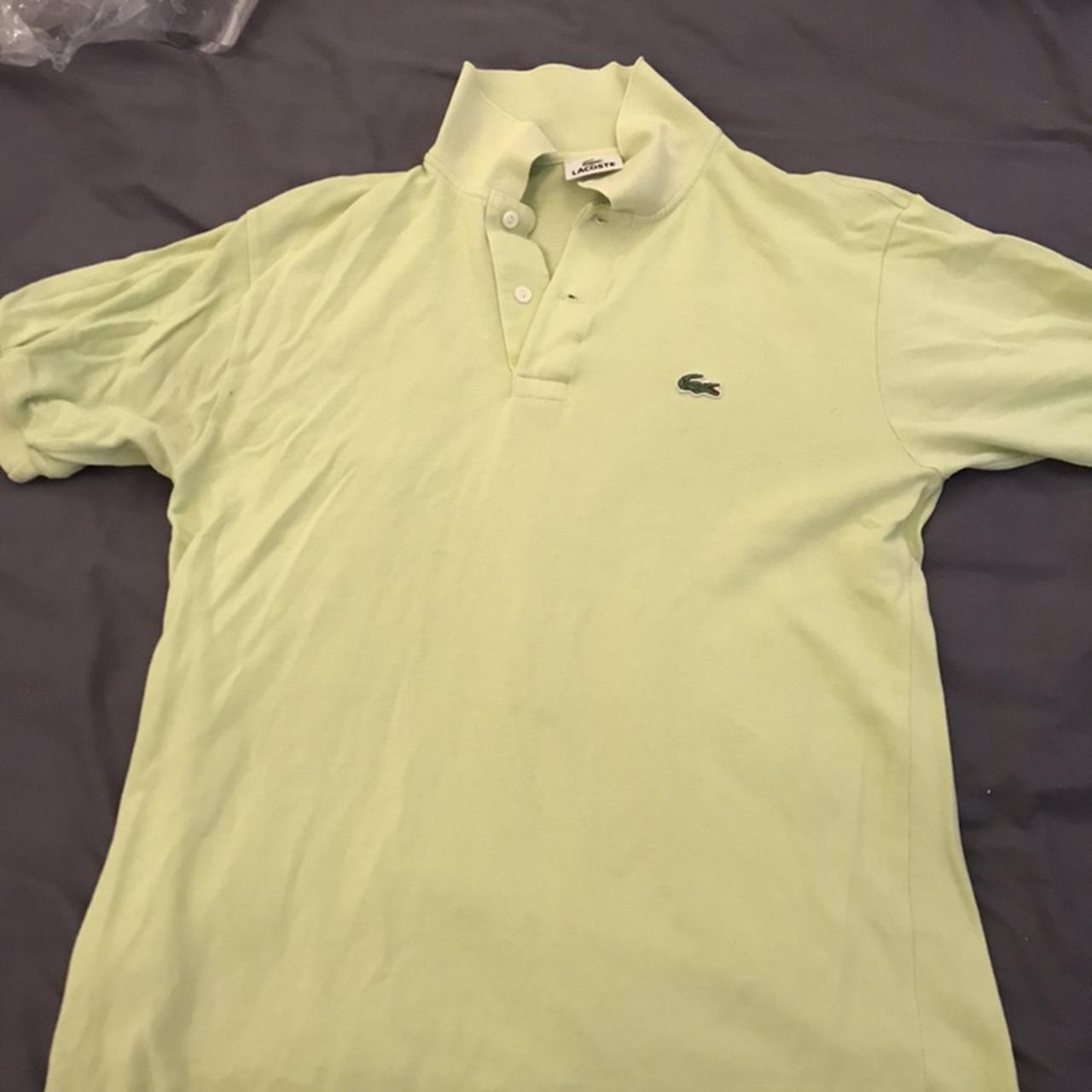 Lacoste polo shirt in green, fair bit of wear to it... - Depop