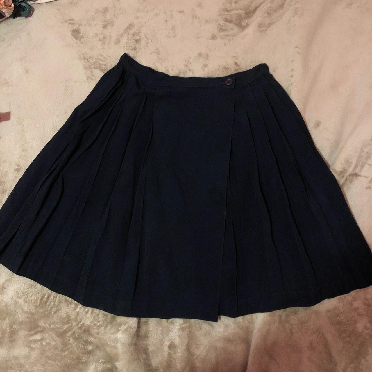 Navy blue wraparound pleated skirt. The waist is 33... - Depop