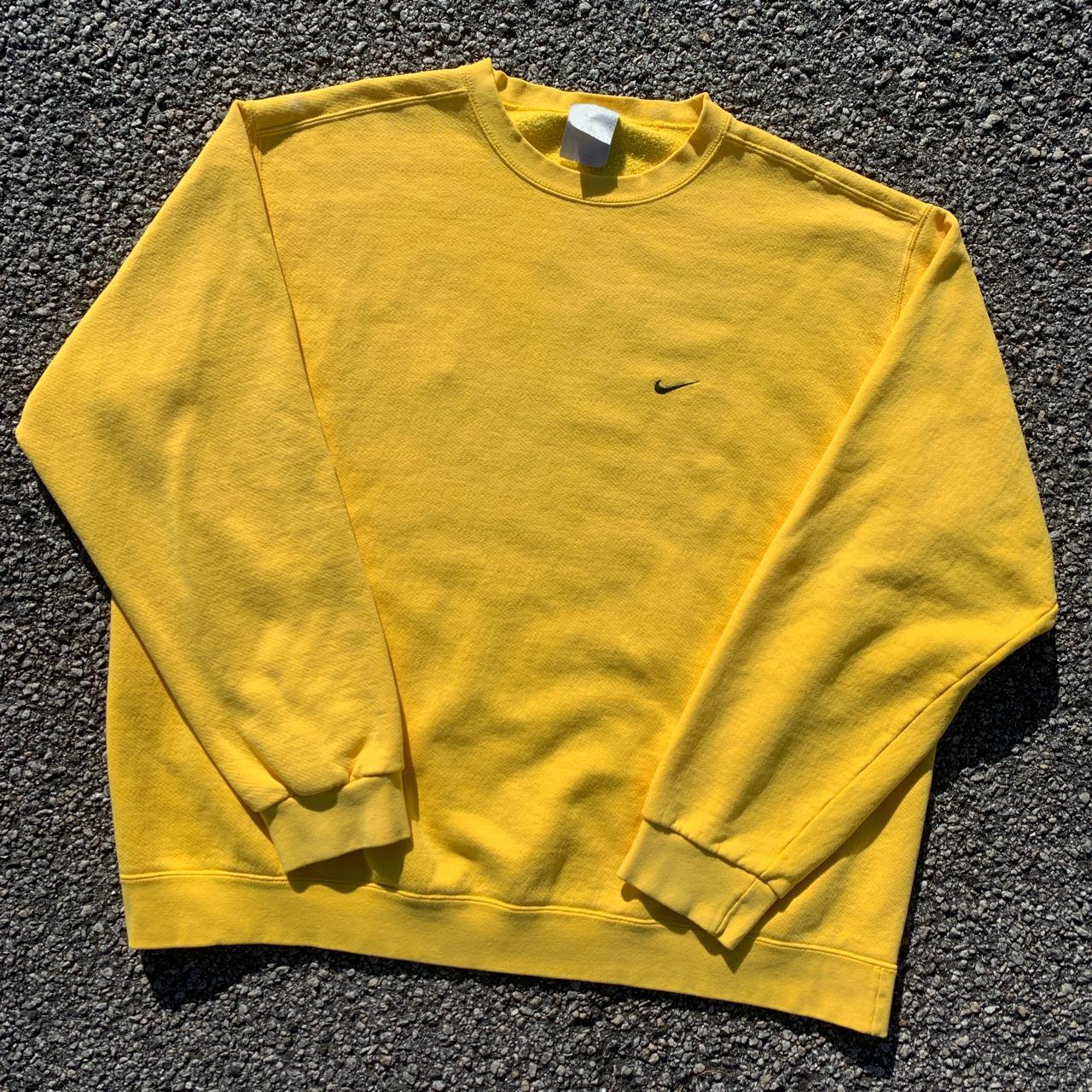 white nike yellow swoosh