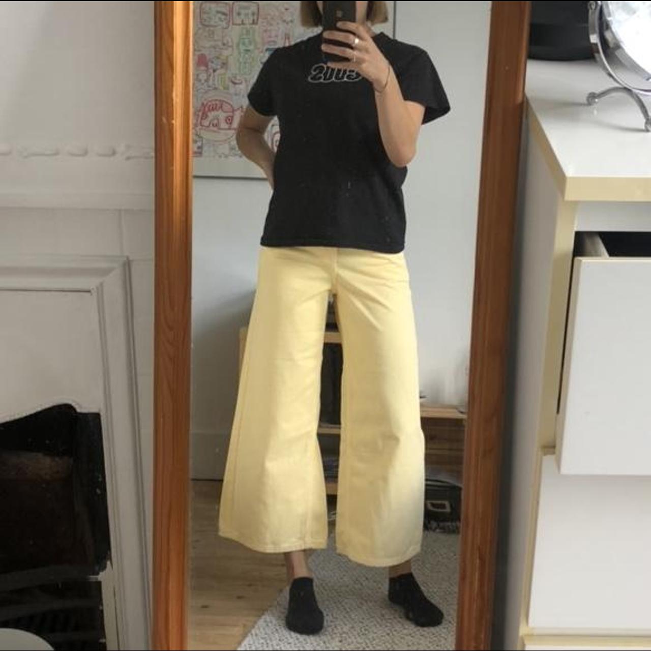 Such beautiful flared pastel yellow jeans! Very... Depop
