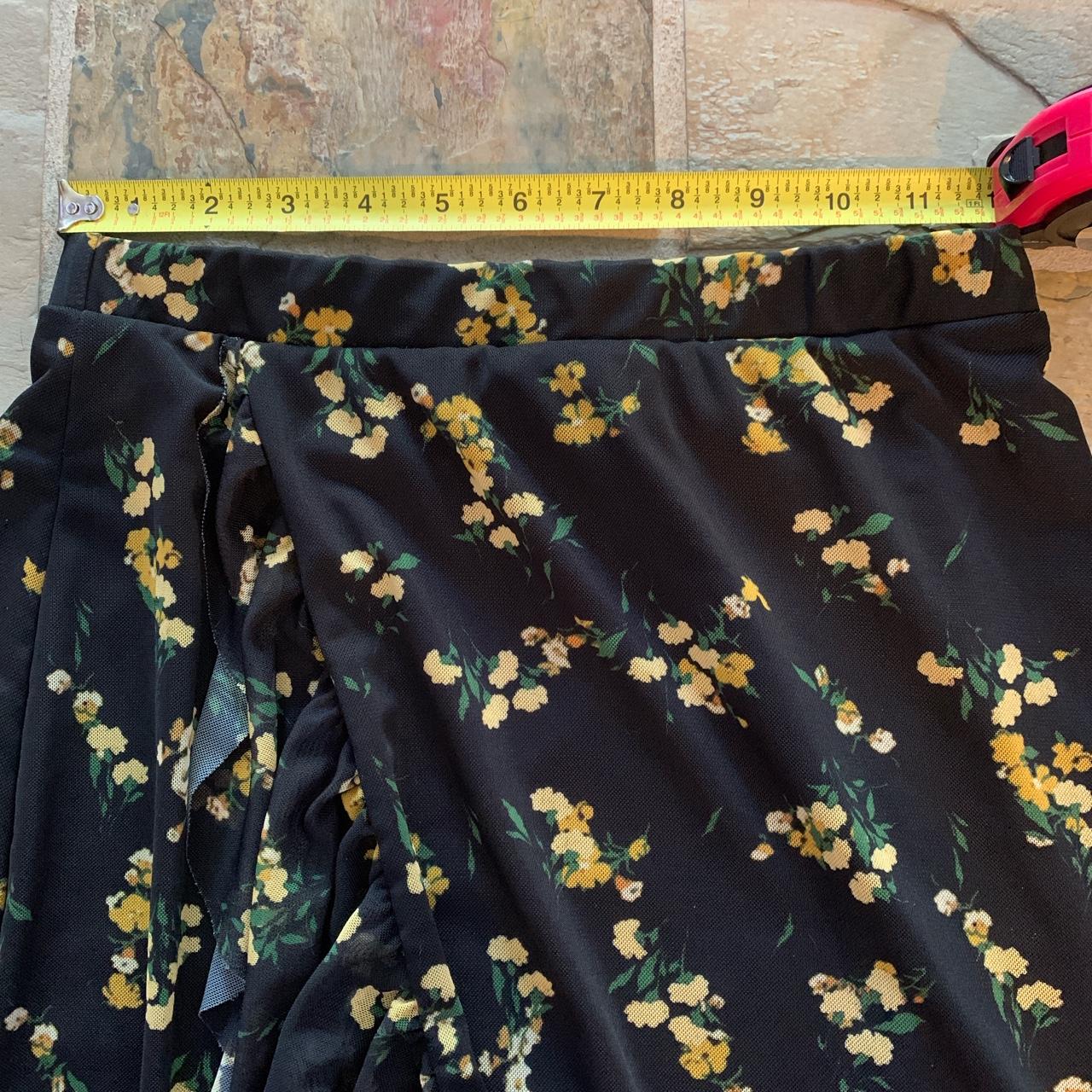 Black skirt yellow top flowers