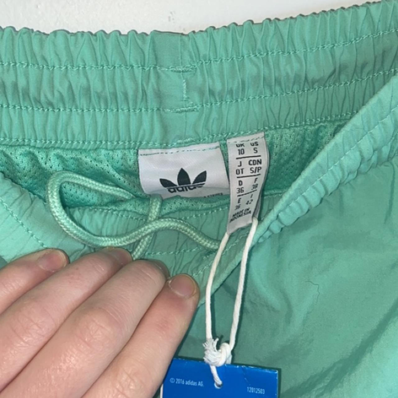 mint green adidas pants