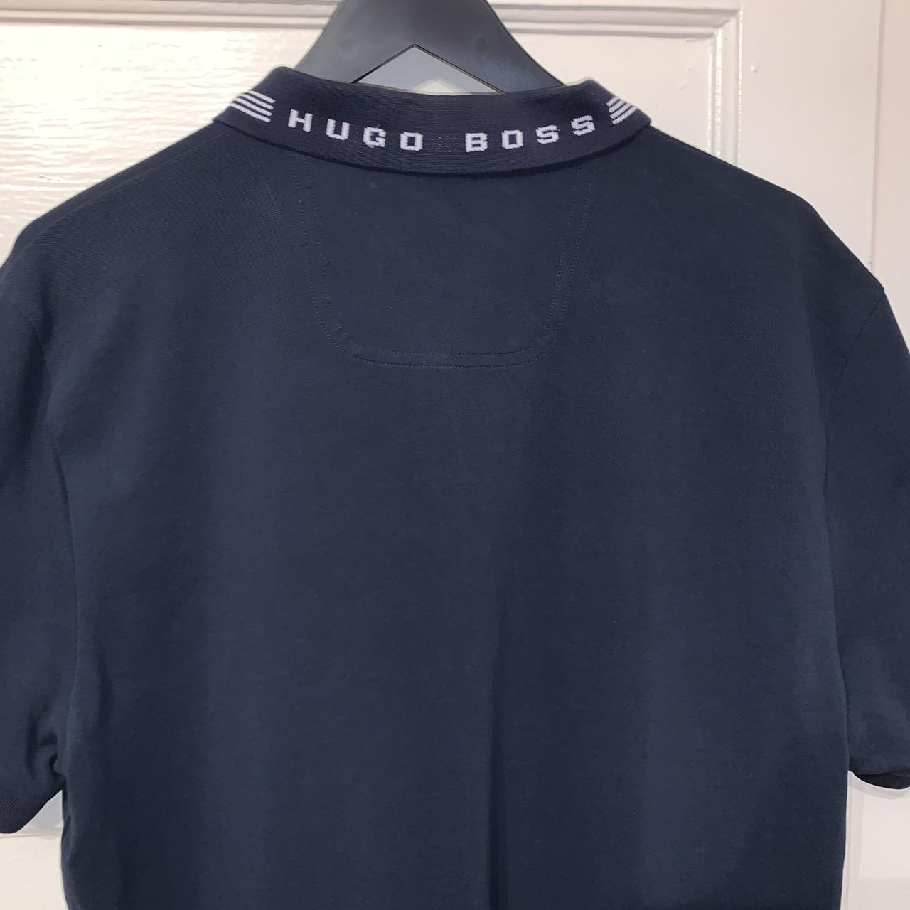 Hugo Boss Green polo in navy 9/10 condition. Slim... - Depop