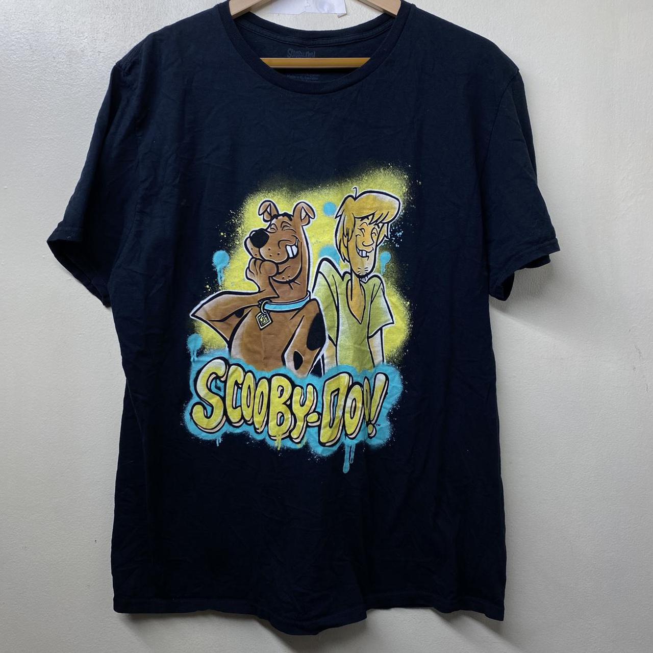 Scooby-Doo T-shirt. The shirt is black with Scooby... - Depop