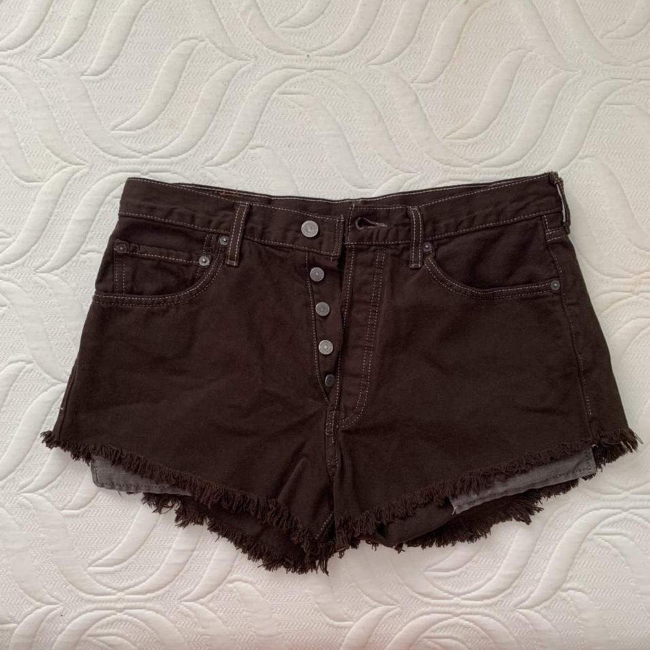 vintage denim levi shorts in dark brown labeled as... - Depop