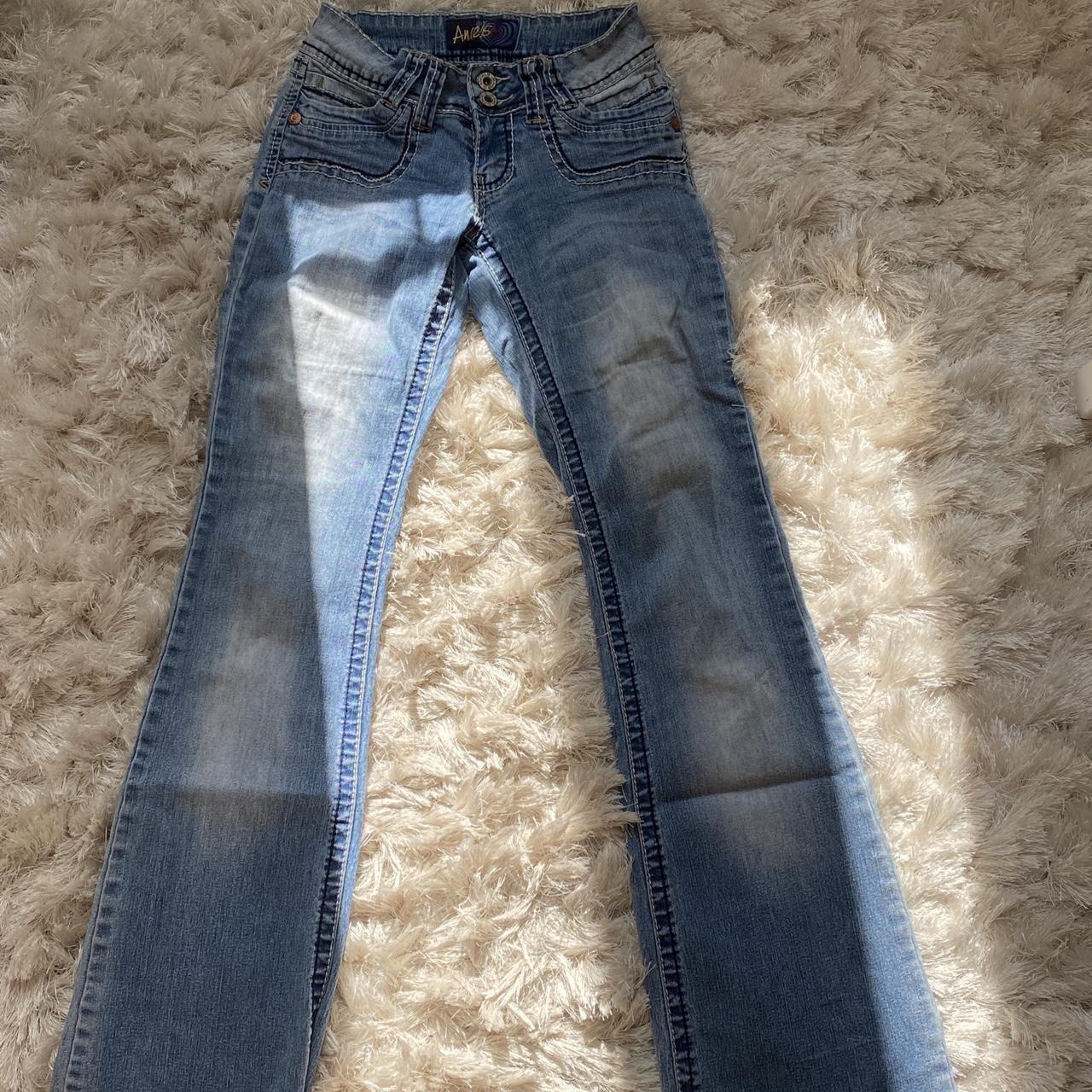 Low rise Bootcut jeans • Embroidered with black and... - Depop