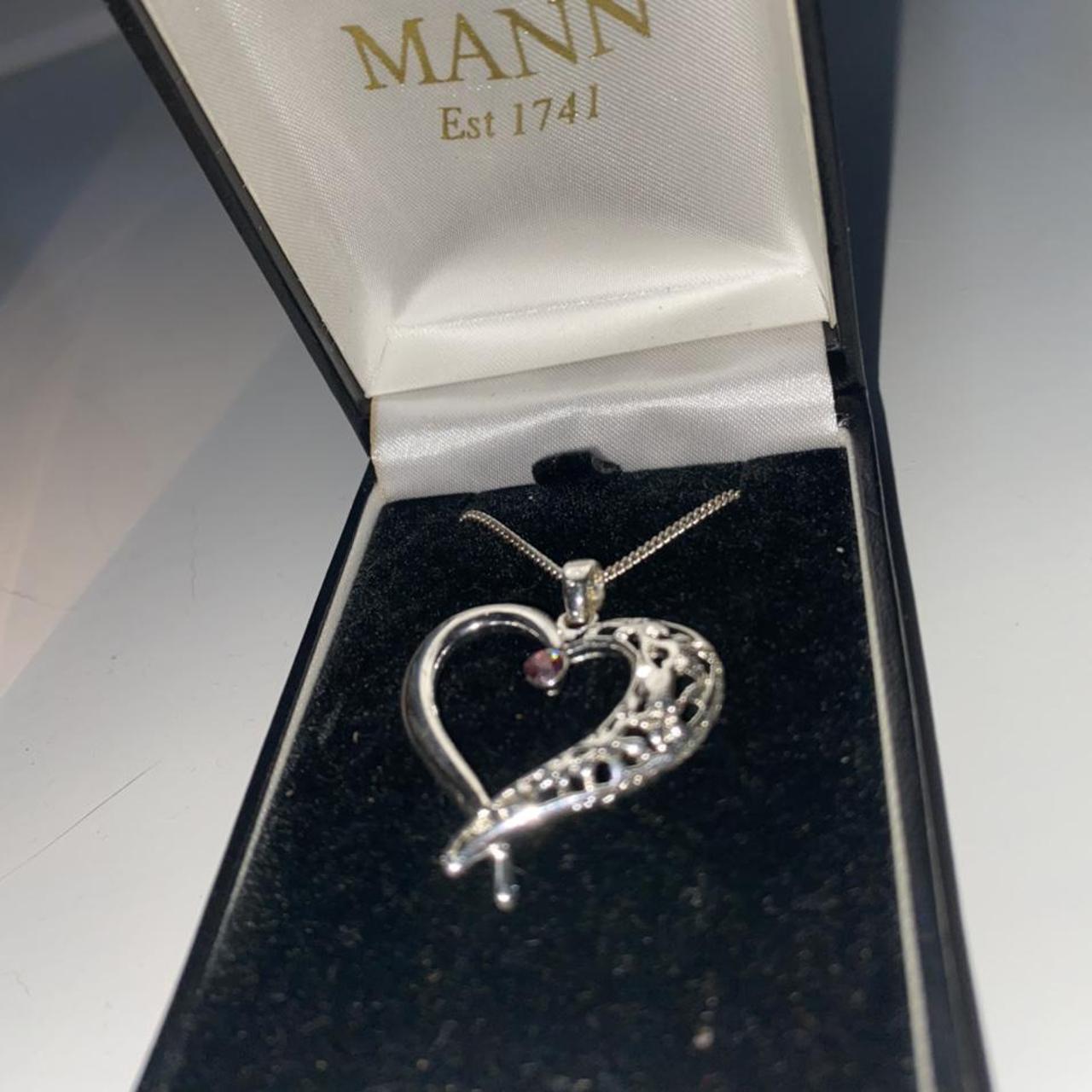 Silver charm necklace from MANN, never worn or taken... Depop