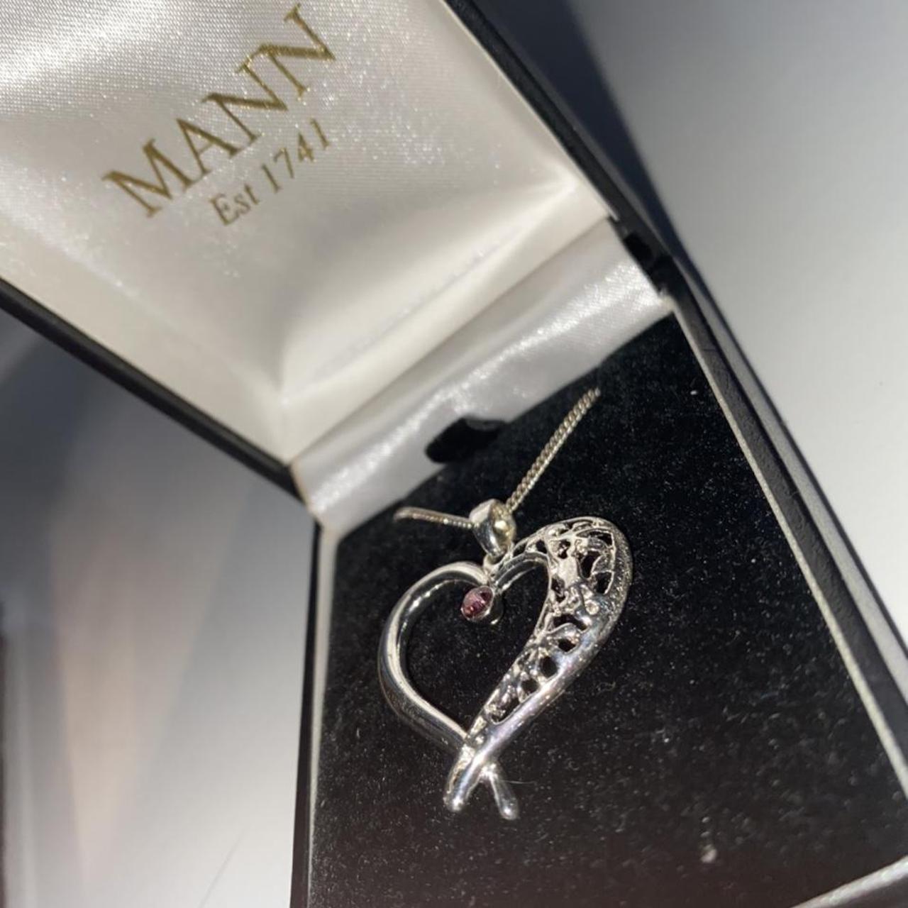 Silver charm necklace from MANN, never worn or taken... Depop