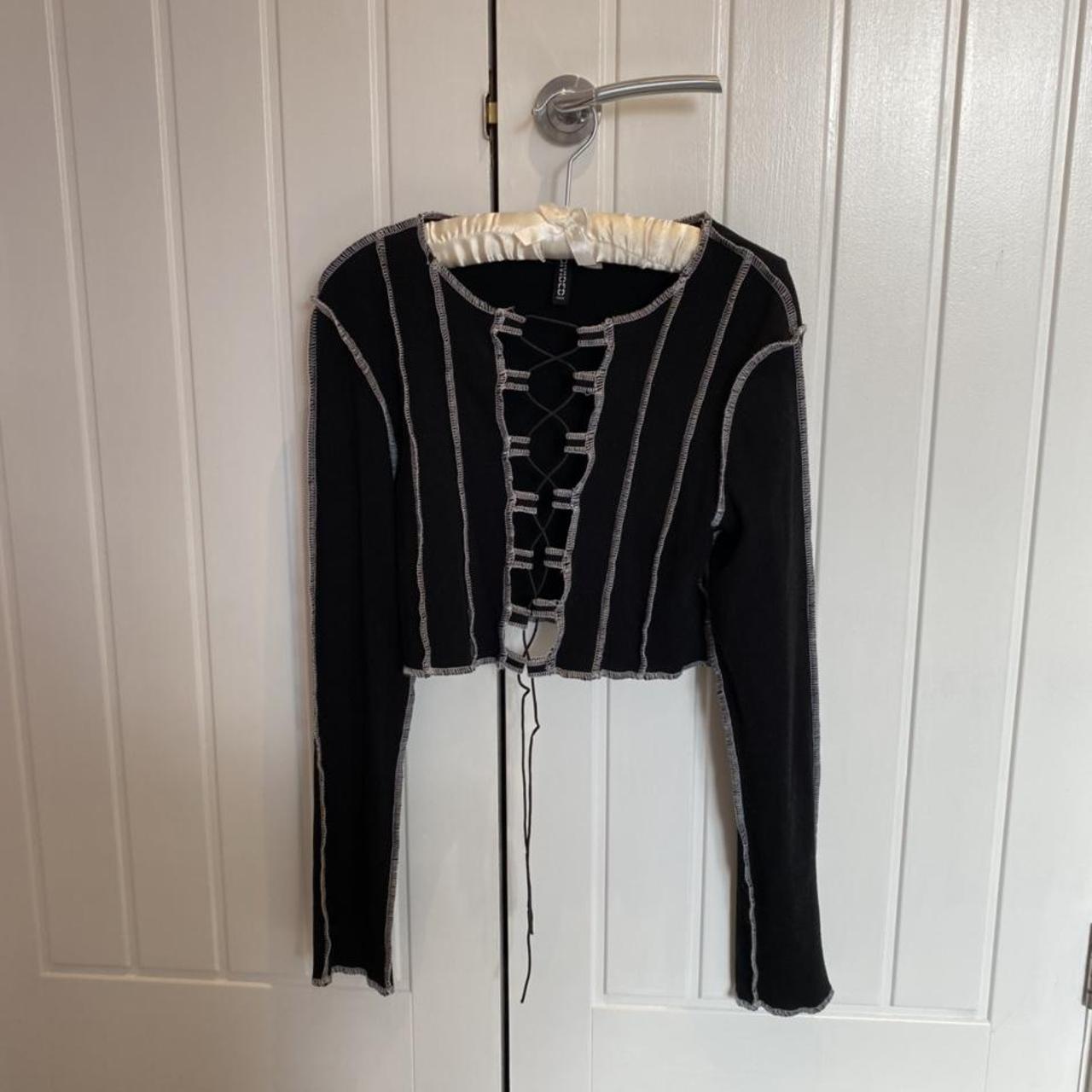 Black long sleeve top with open middle, and white... - Depop