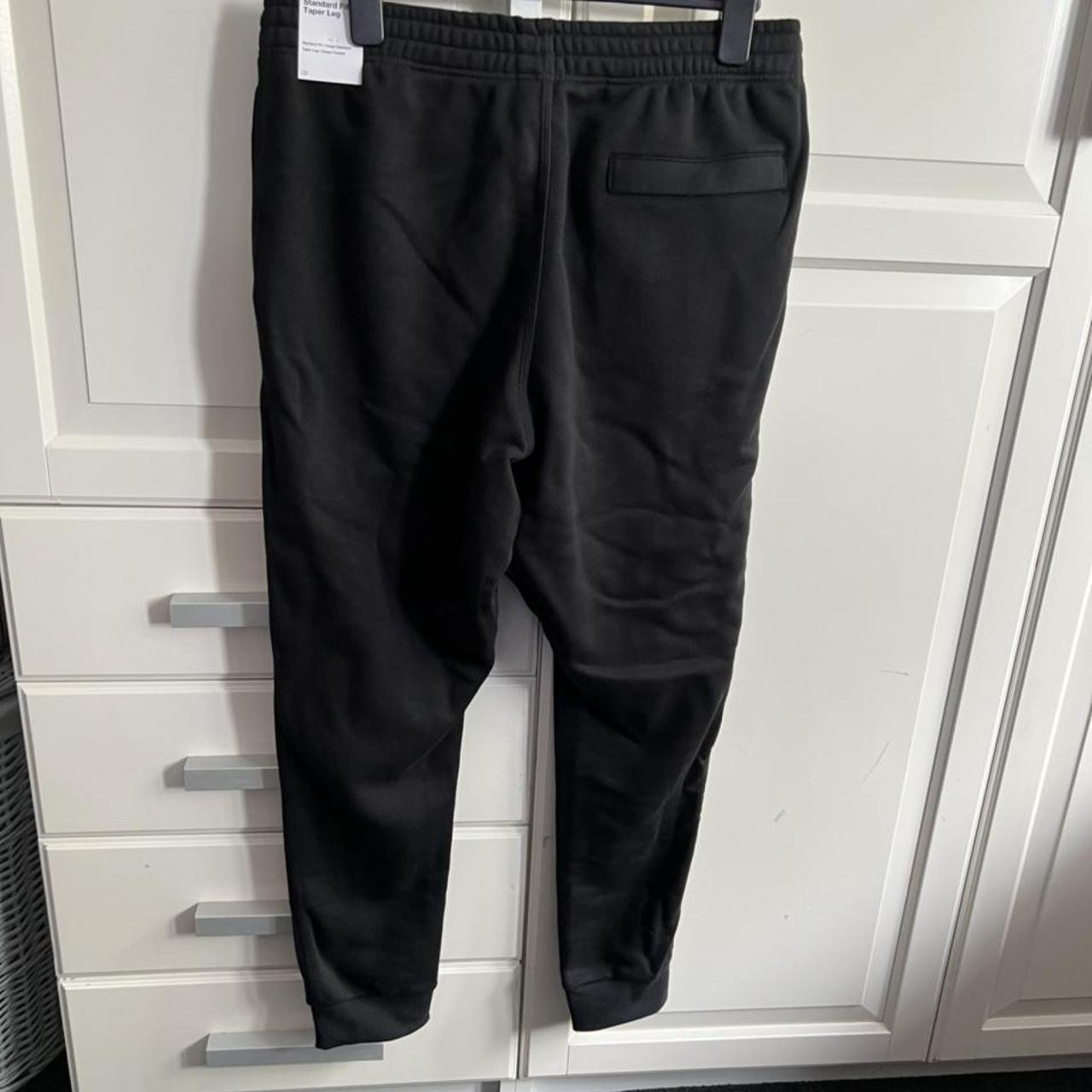 Black Nike Standard Fit Taper Leg tracksuit bottoms... - Depop