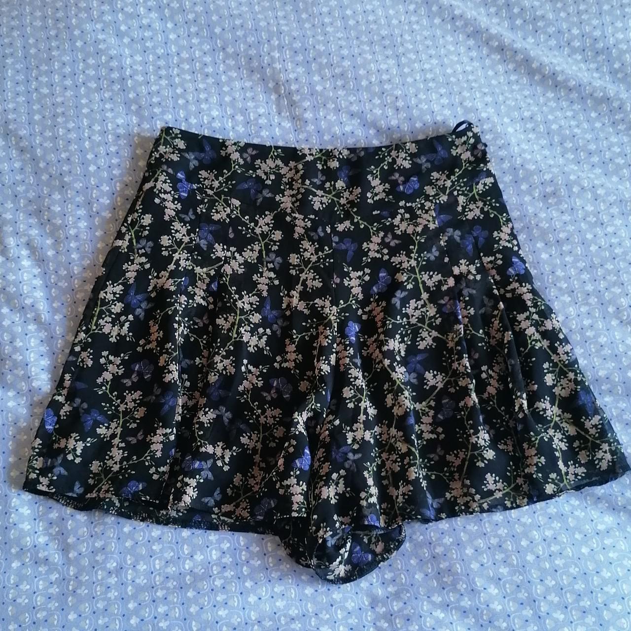 Flower and butterfly print skort. Black lining... - Depop