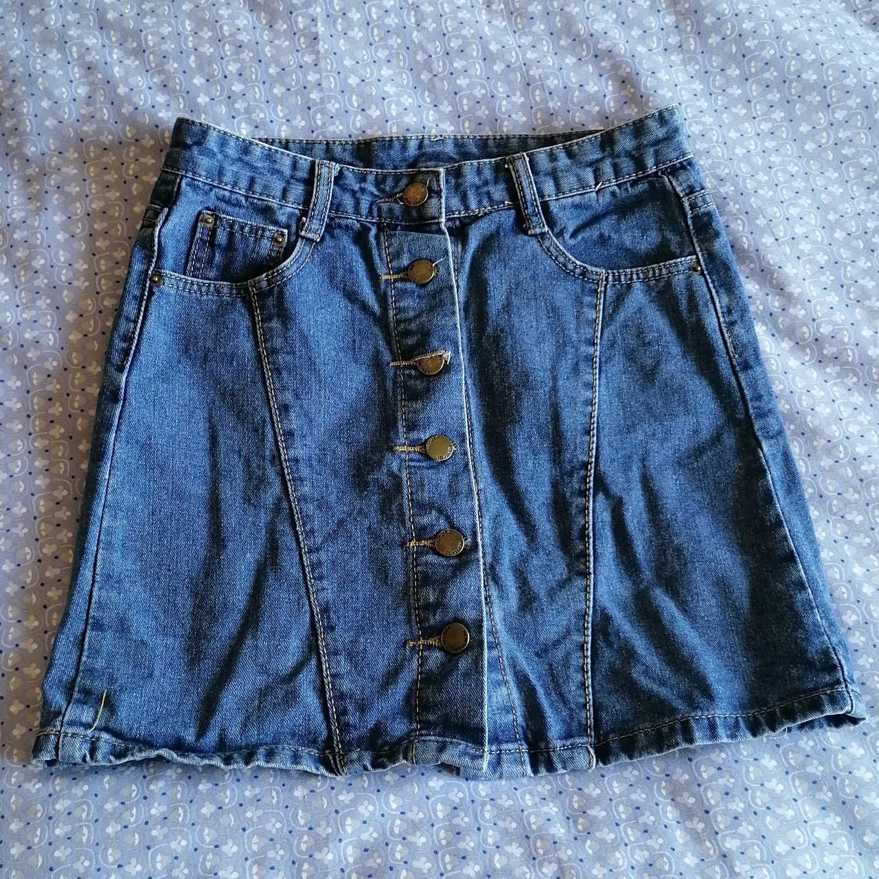 Mini blue denim mini-skirt. Buttons at front to... - Depop