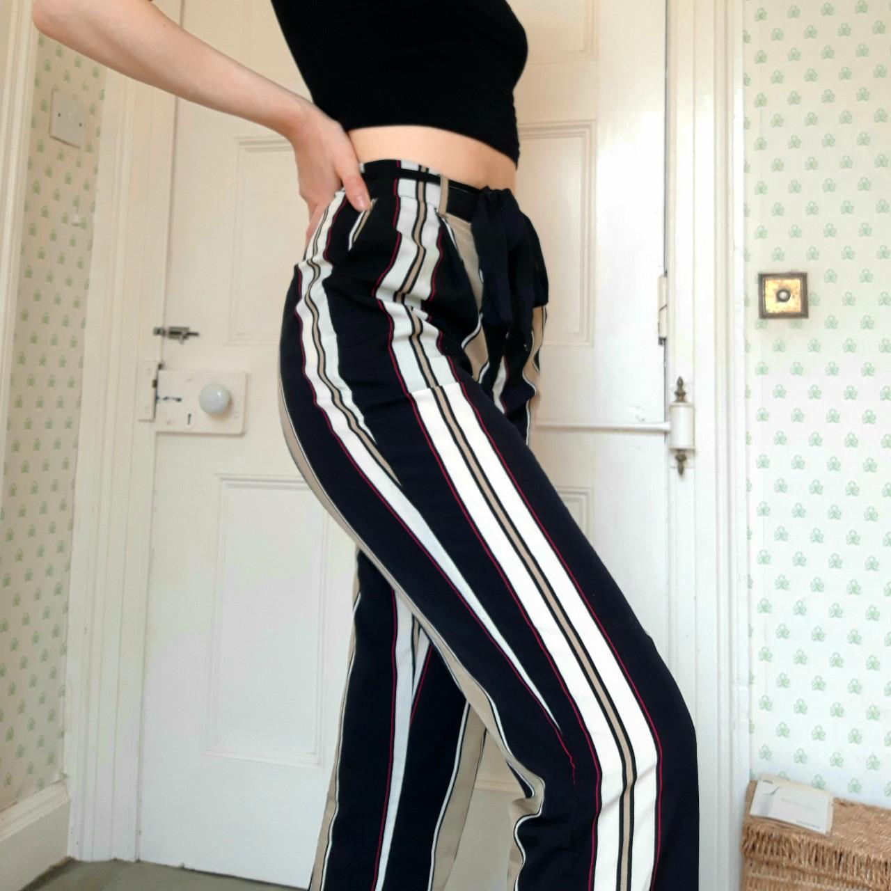 Red / gold / black / white striped flared trousers,... Depop