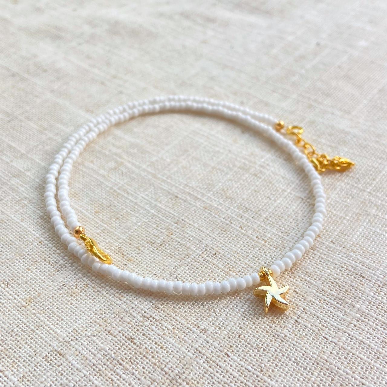 Plain white glass seed beaded necklace with a 24Kt... Depop