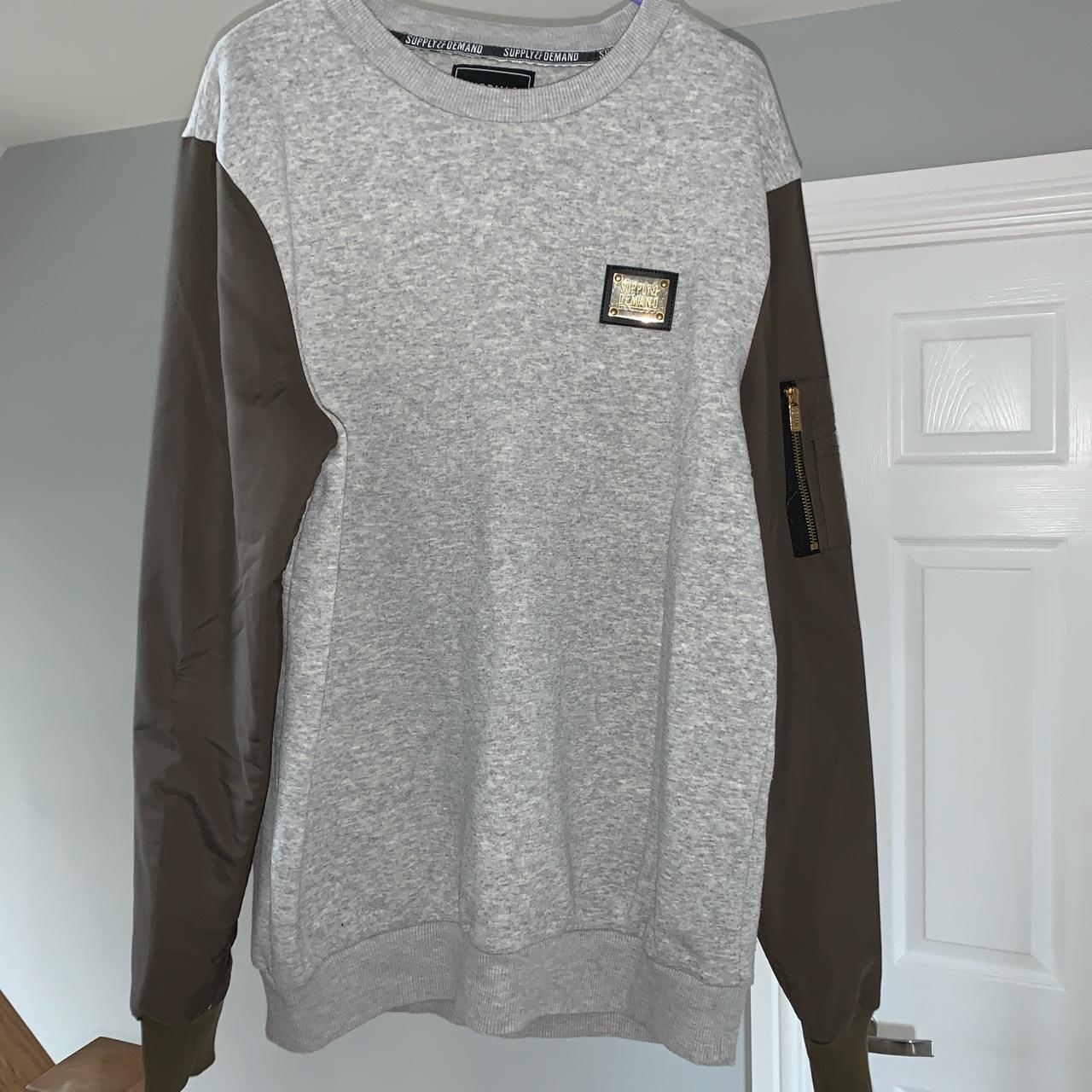 Supply and demand grey jumper with green sleeves... - Depop