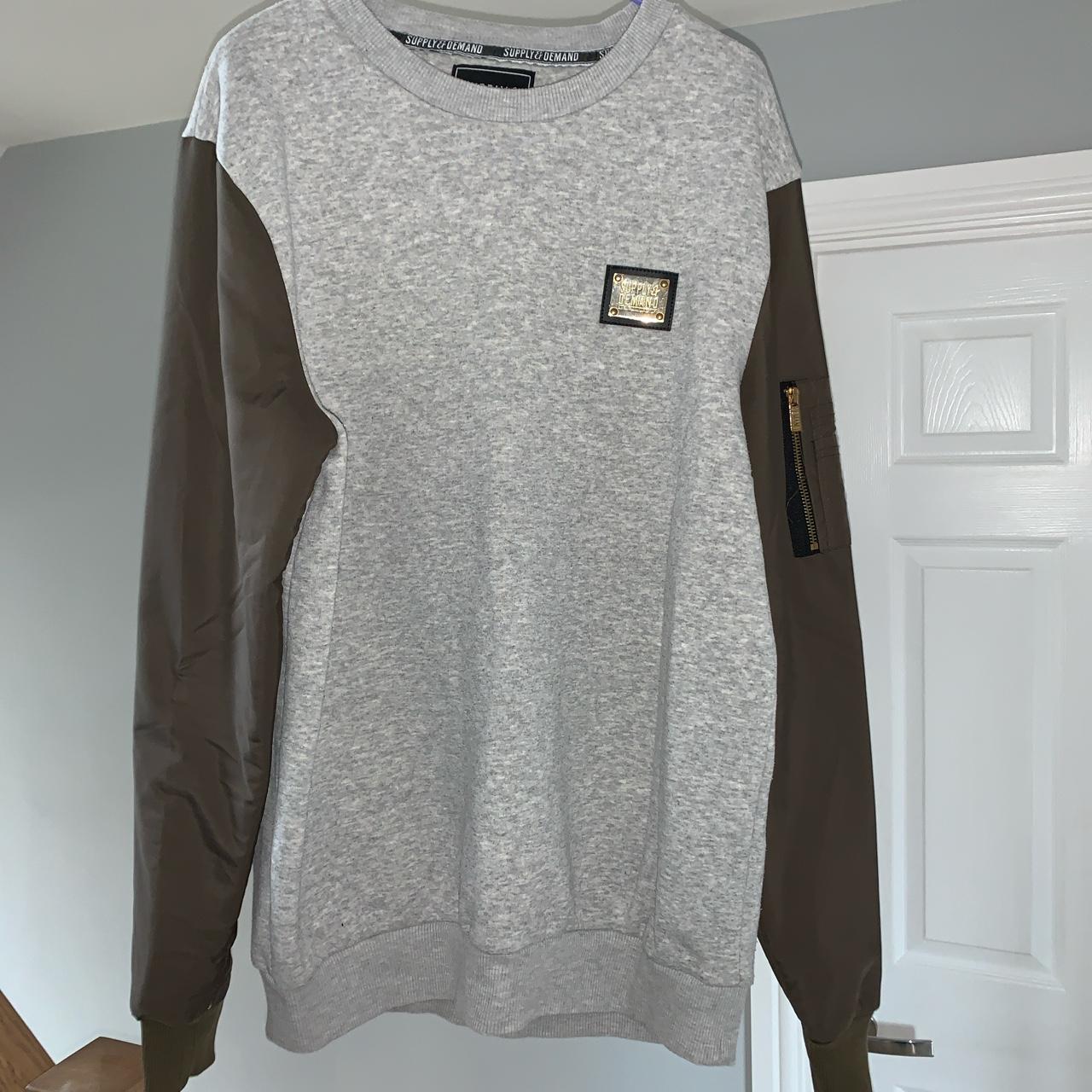 Supply and demand grey jumper with green sleeves... Depop