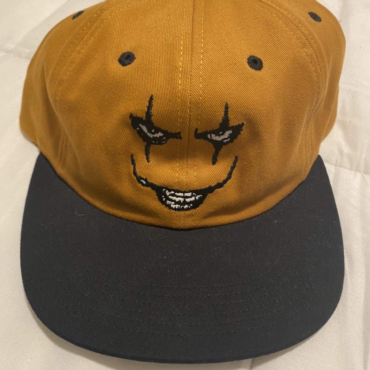 black and yellow supreme hat