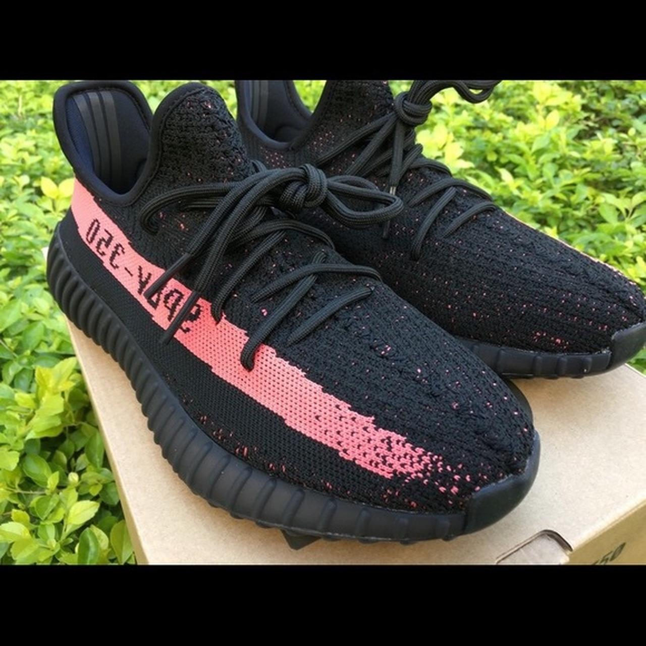 Black yeezys hot sale with pink stripe