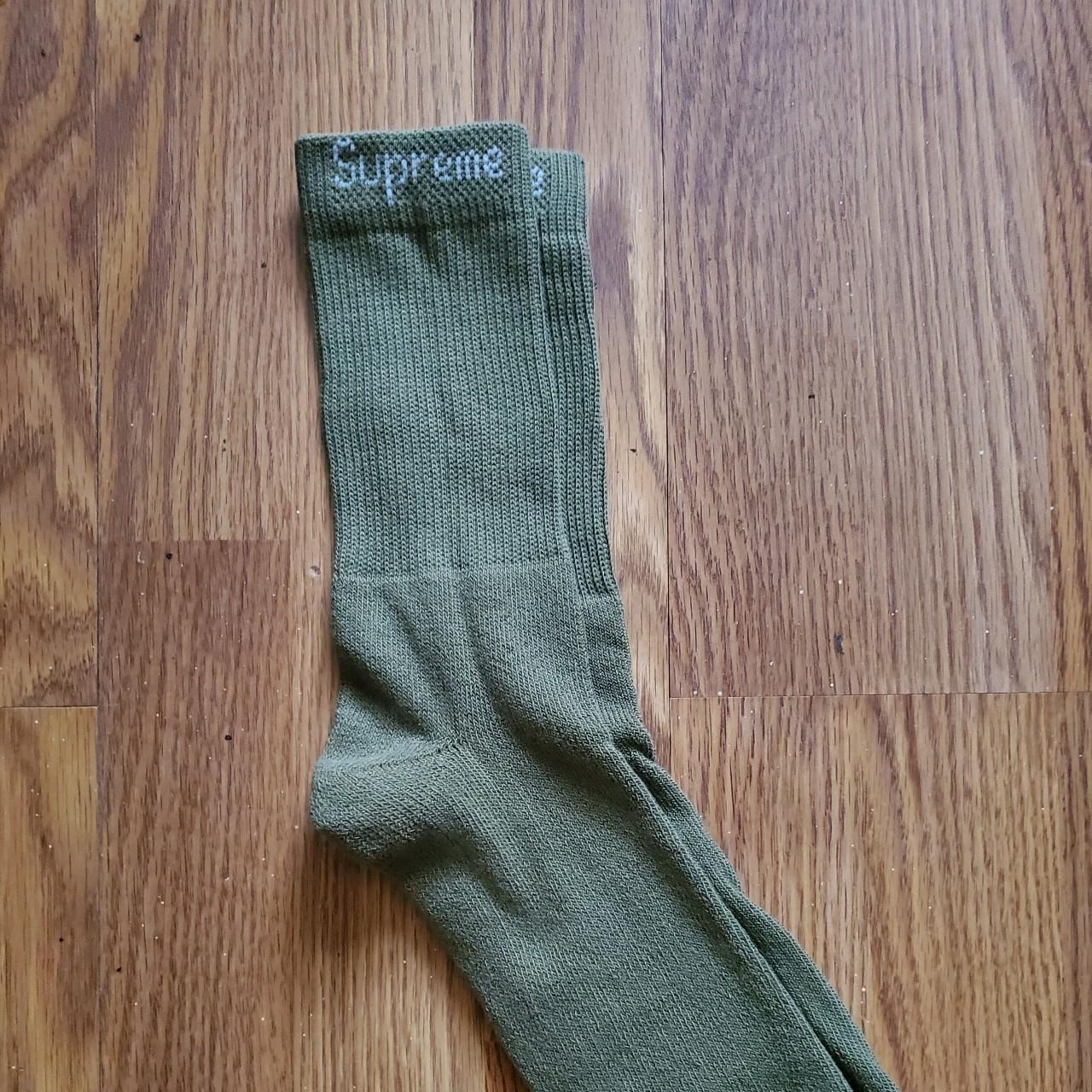 One pair of olive green supreme hanes socks mens... - Depop