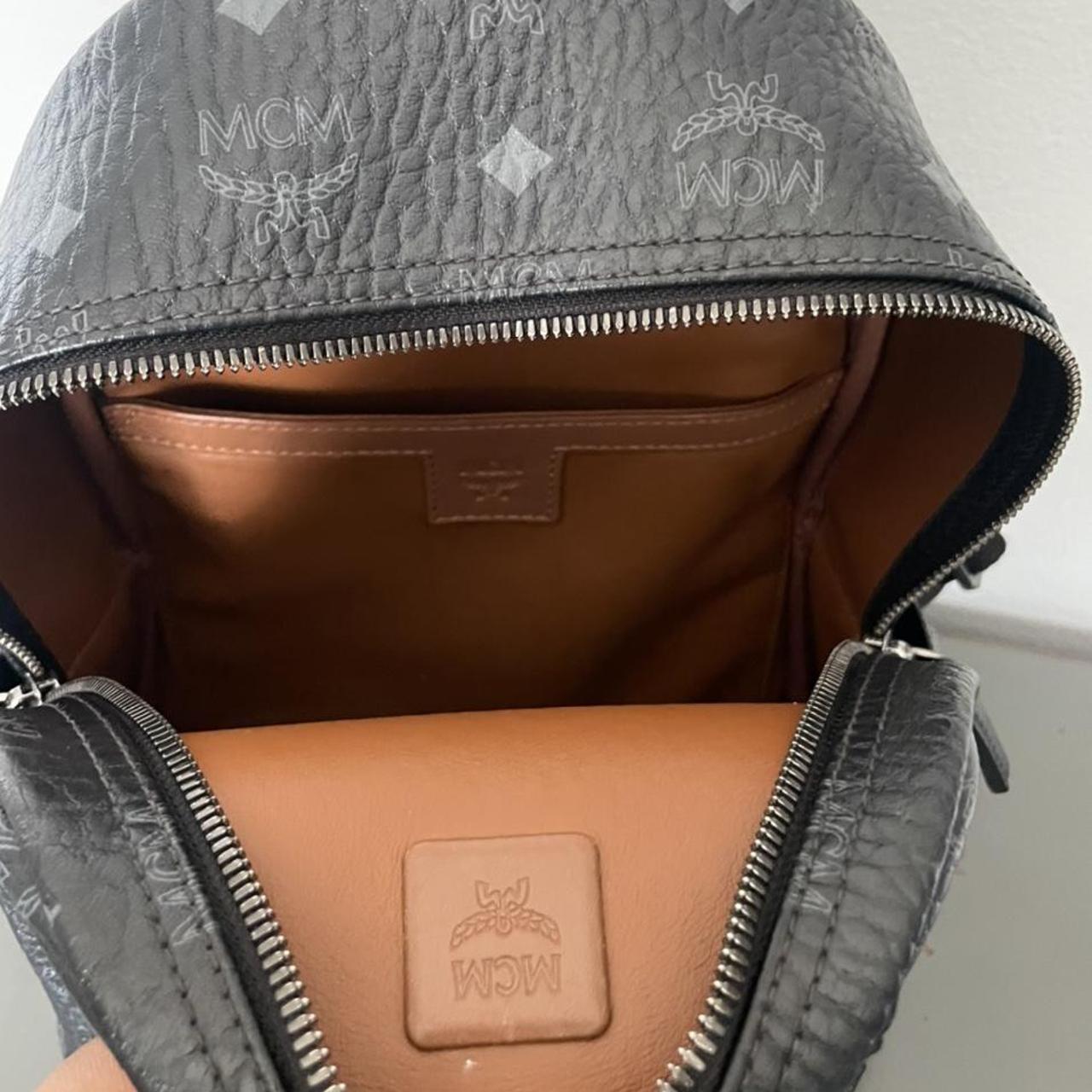 Small, pre-loved, black MCM backpack with minor wear - Depop