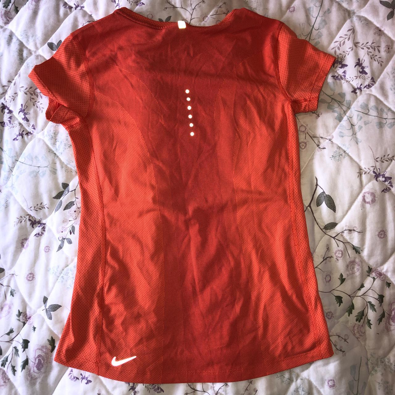 Orange Nike Dri-Fit Orioles t-shirt. The size is an - Depop