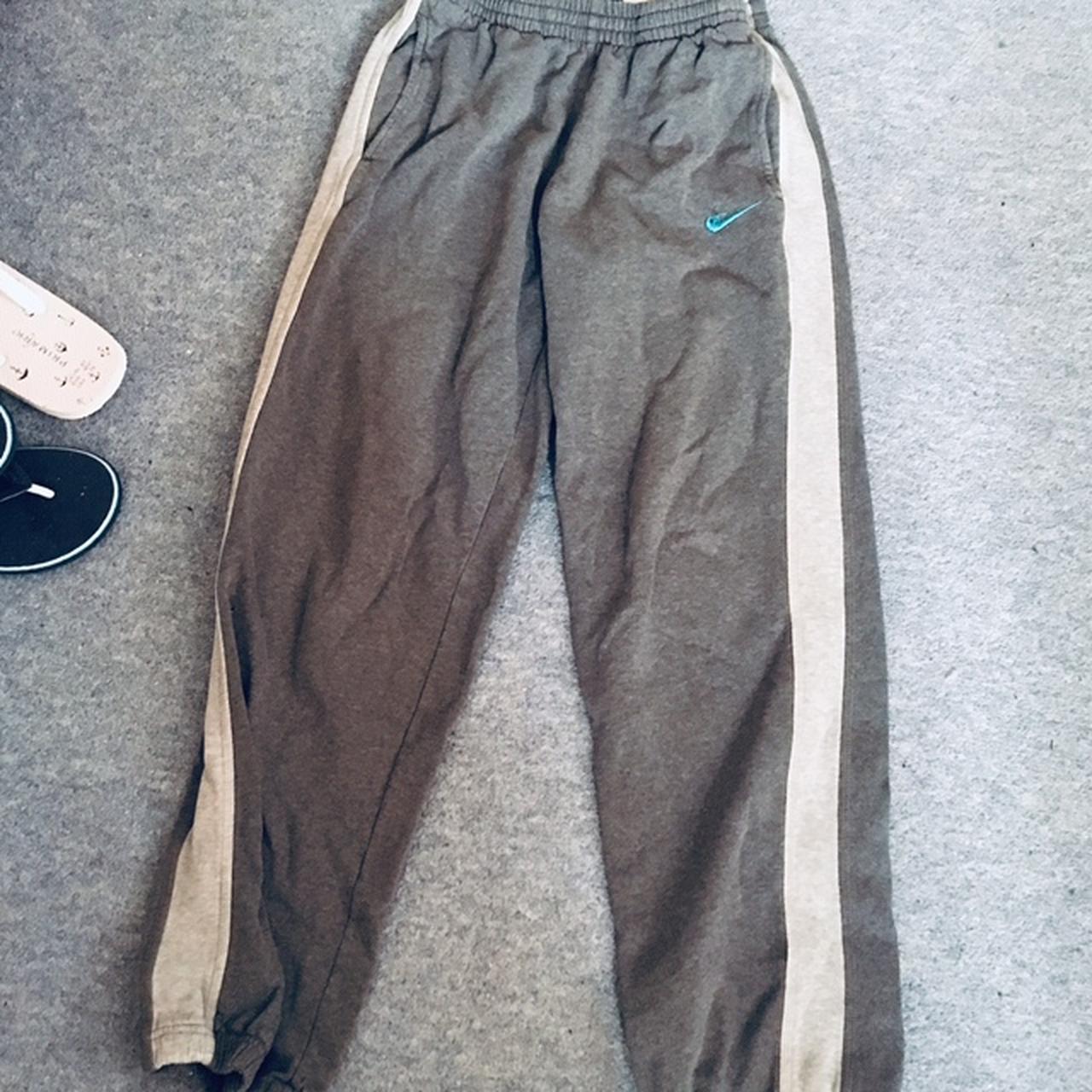 grey nike joggers with white stripe