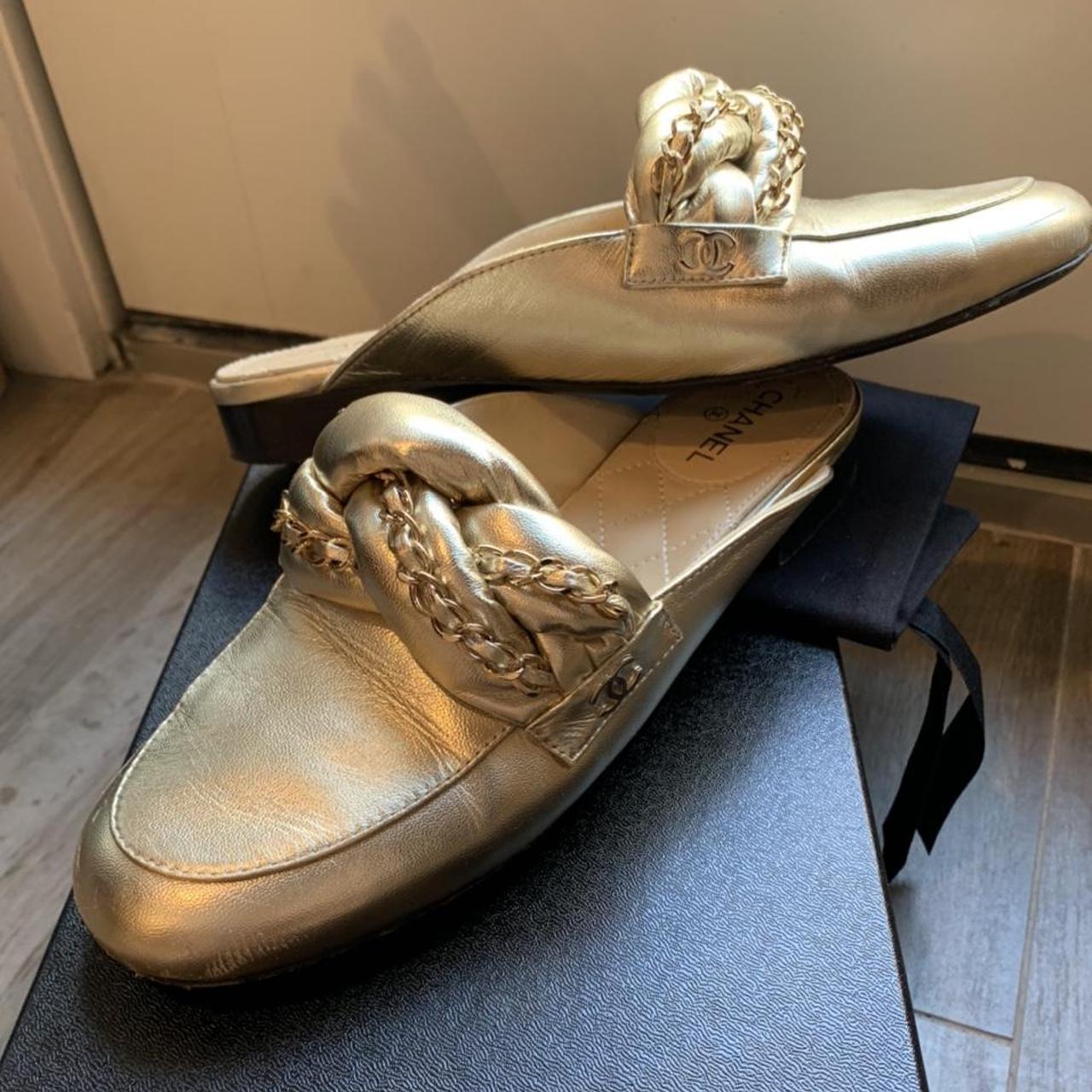 Chanel store gold loafers