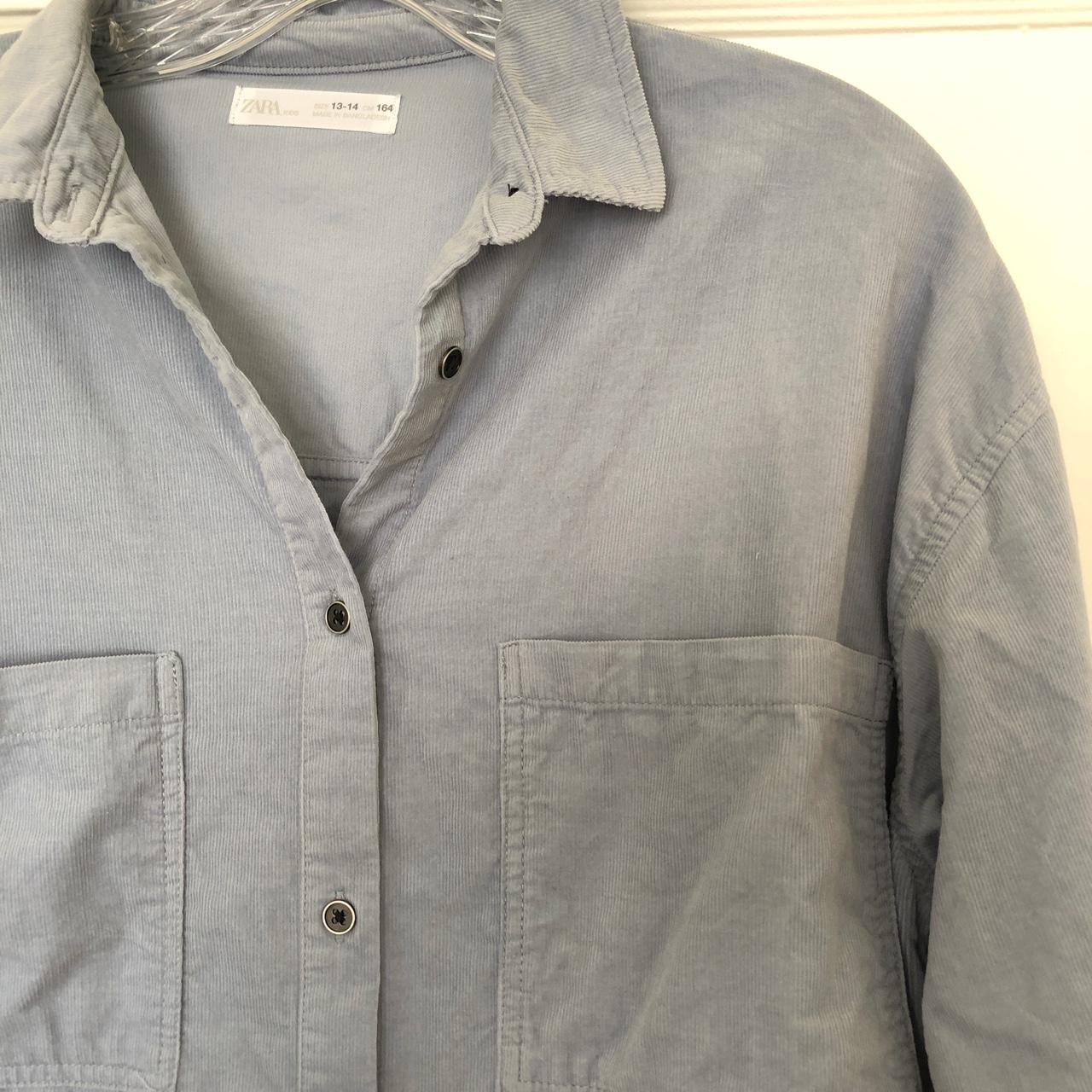 Light blue corduroy shirt with writing on the... - Depop