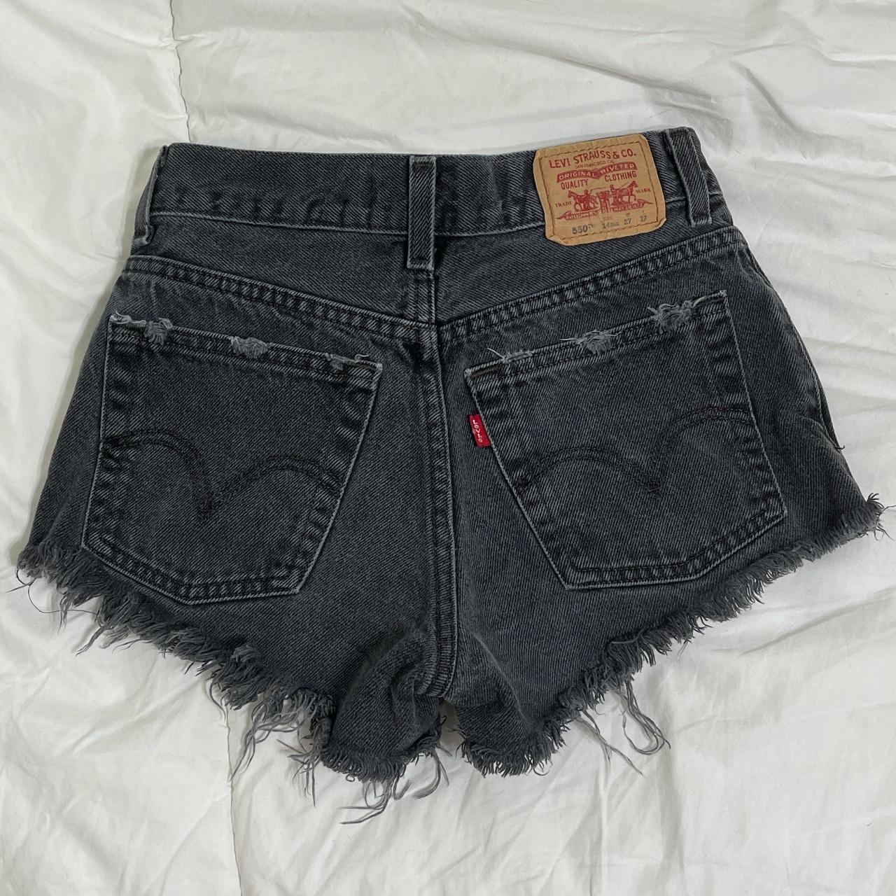 Black distressed on sale levi shorts