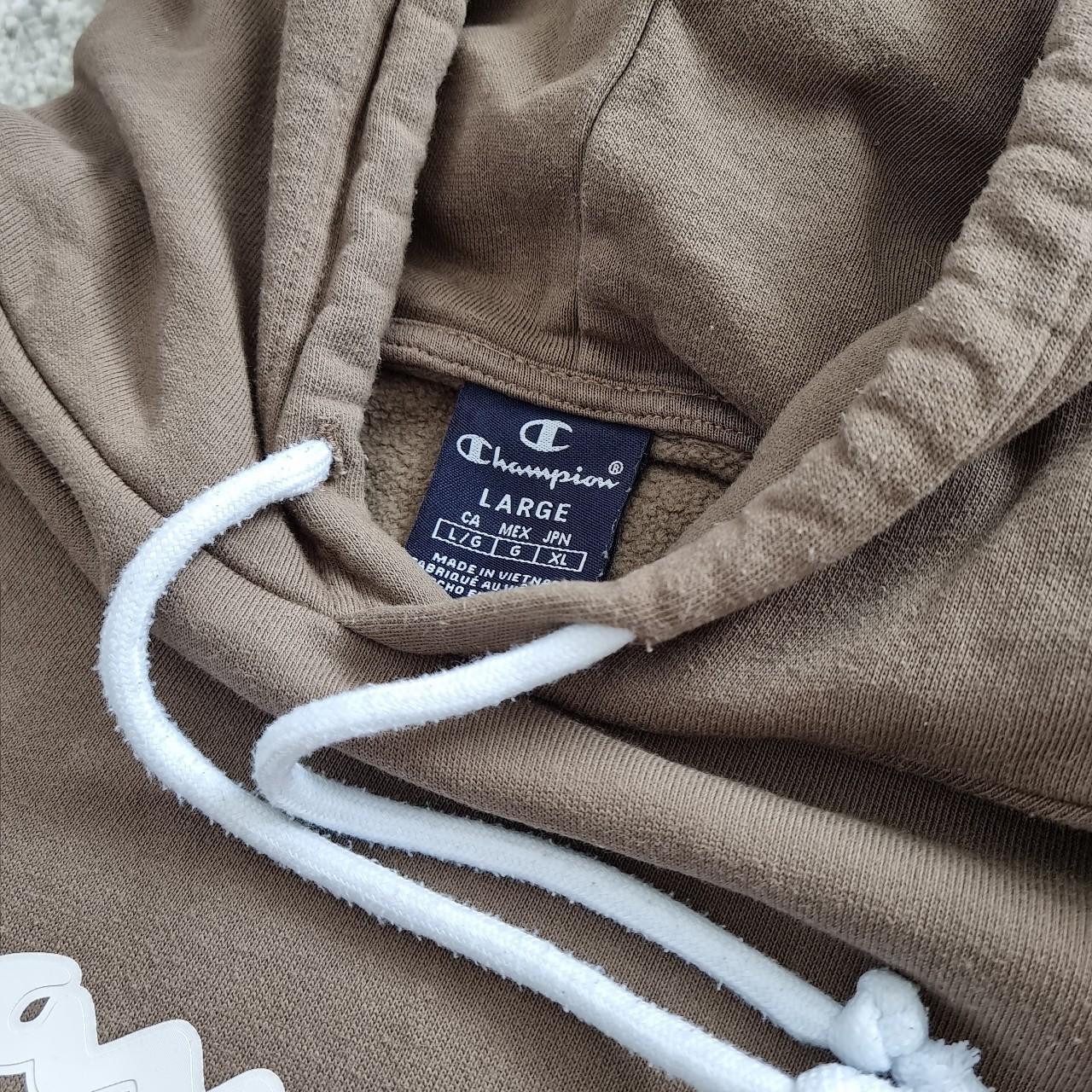 Champion hoodie in light brown. Size stated large... - Depop