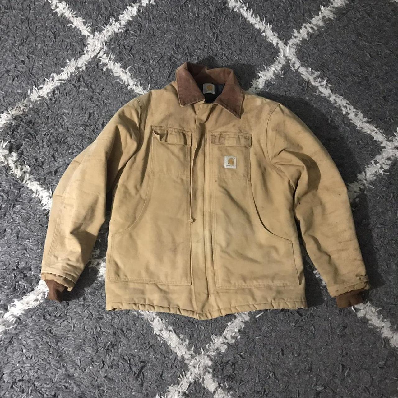 Men’s faded and stained Carhartt work jacket. The... - Depop