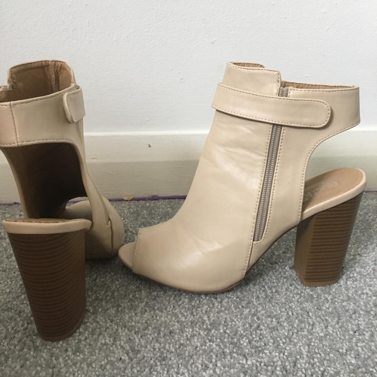 Pale pink heels with zips. Good condition as worn... - Depop