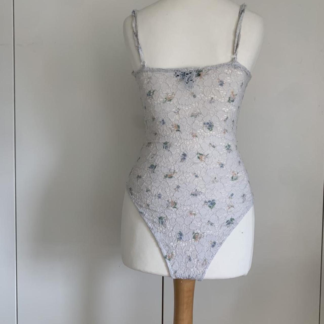 White floral lace bodysuit with a cute multicolour... Depop