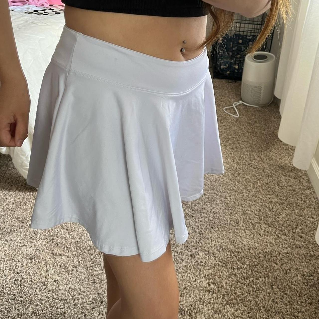 White athletic tennis skirt, spandex material and... Depop