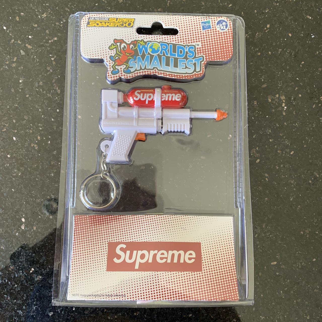 Supreme®/Super Soaker 50 Water Blaster™ Keychain. - Depop