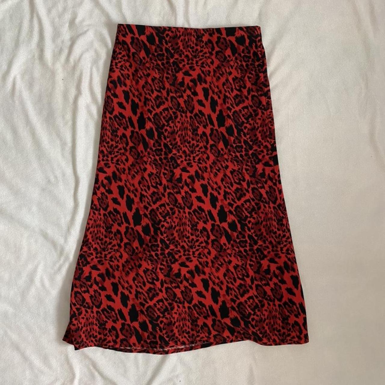 -red and black leopard print midi skirt from... - Depop