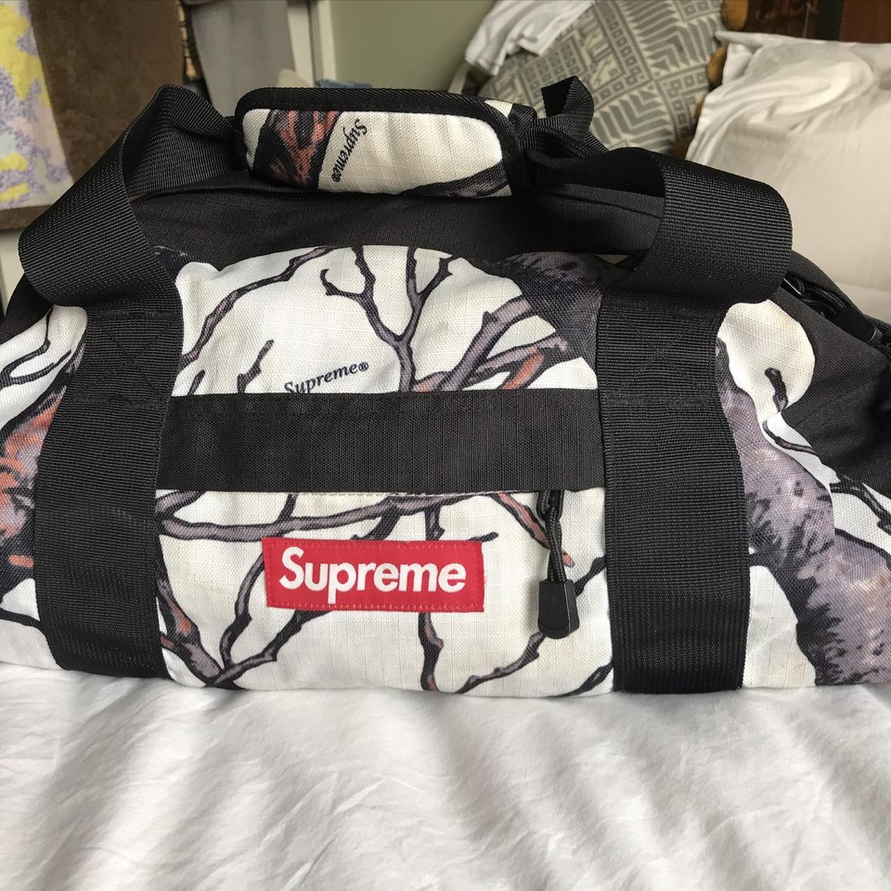 Supreme logo reflective duffel bag 8/10 condition, - Depop