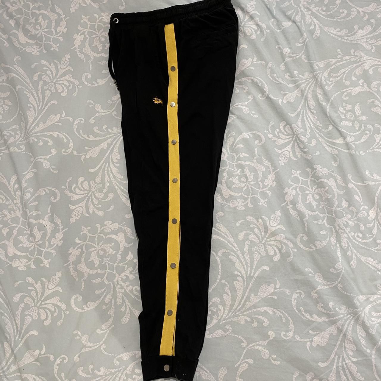 Stussy panel snap trackpants in yellow,