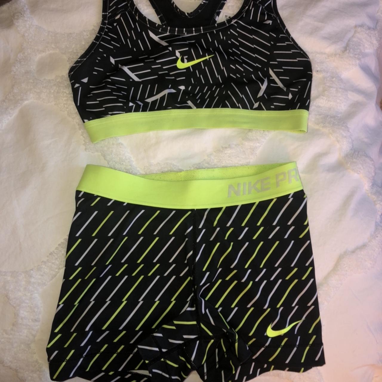 Neon green and black Nike Pro shorts and bra set.