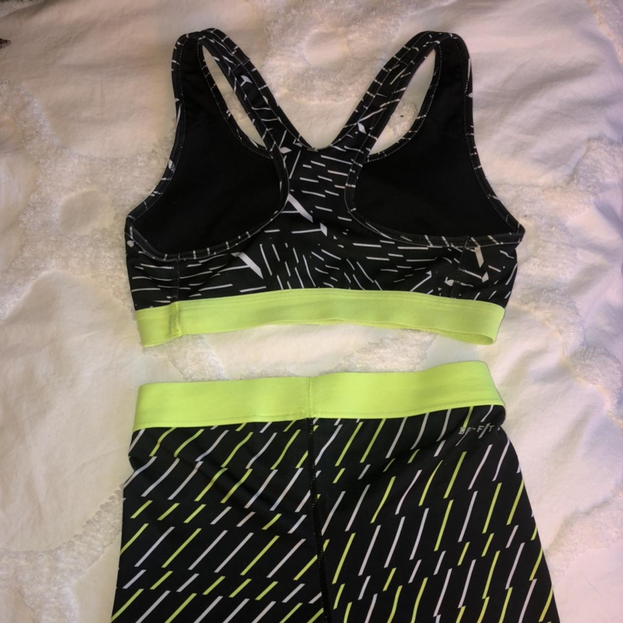 Neon green and black Nike Pro shorts and bra set.