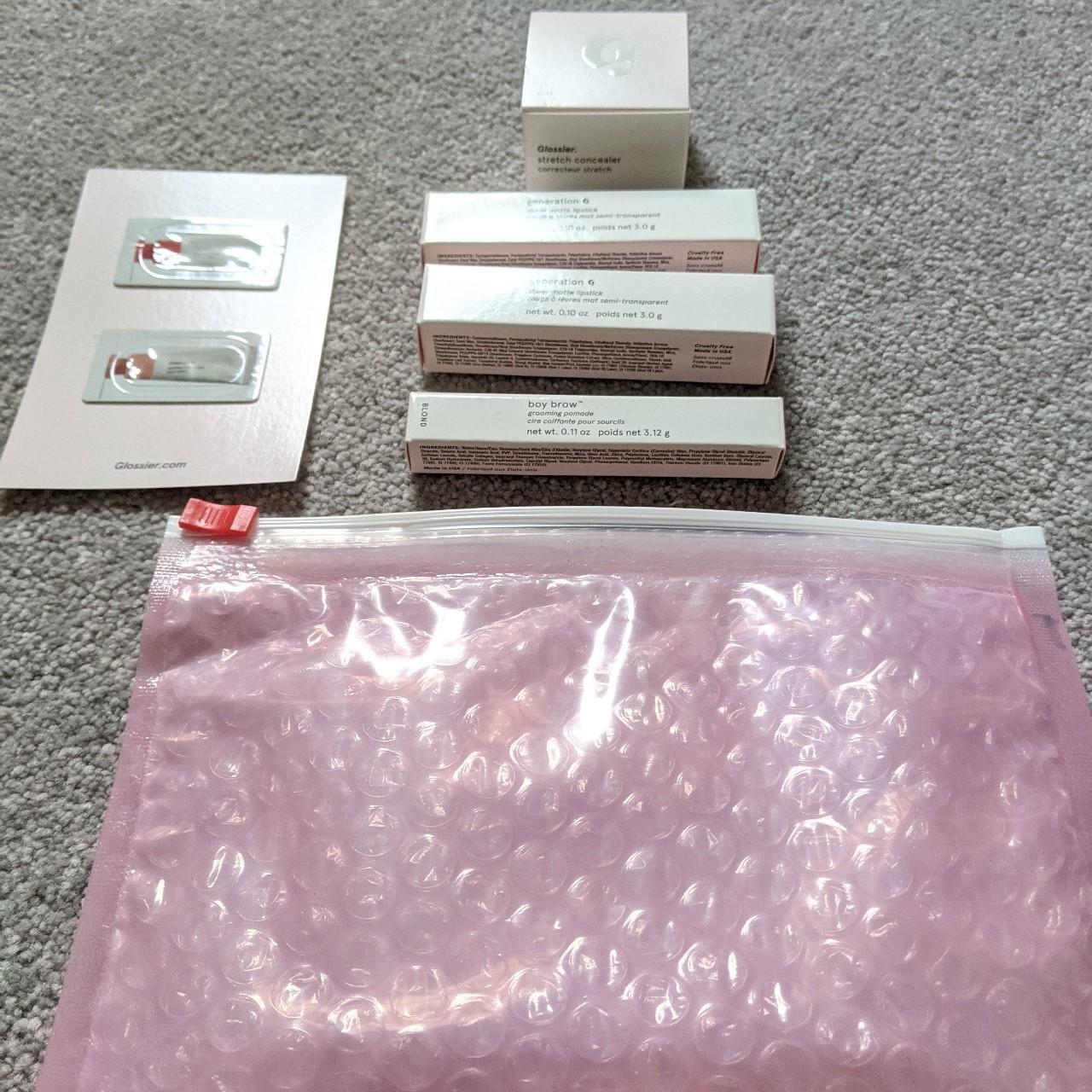 Glossier empty boxes, bubble wrap carry case and... Depop