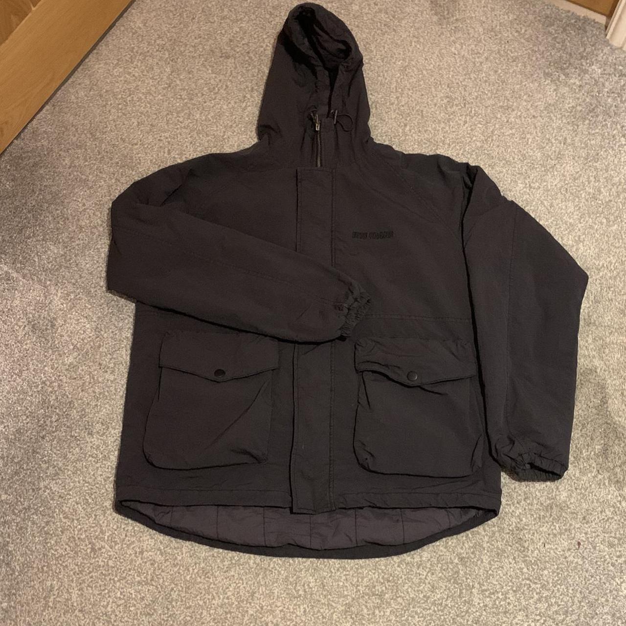 Urban Outfitters Black front pocket puffer coat in... - Depop